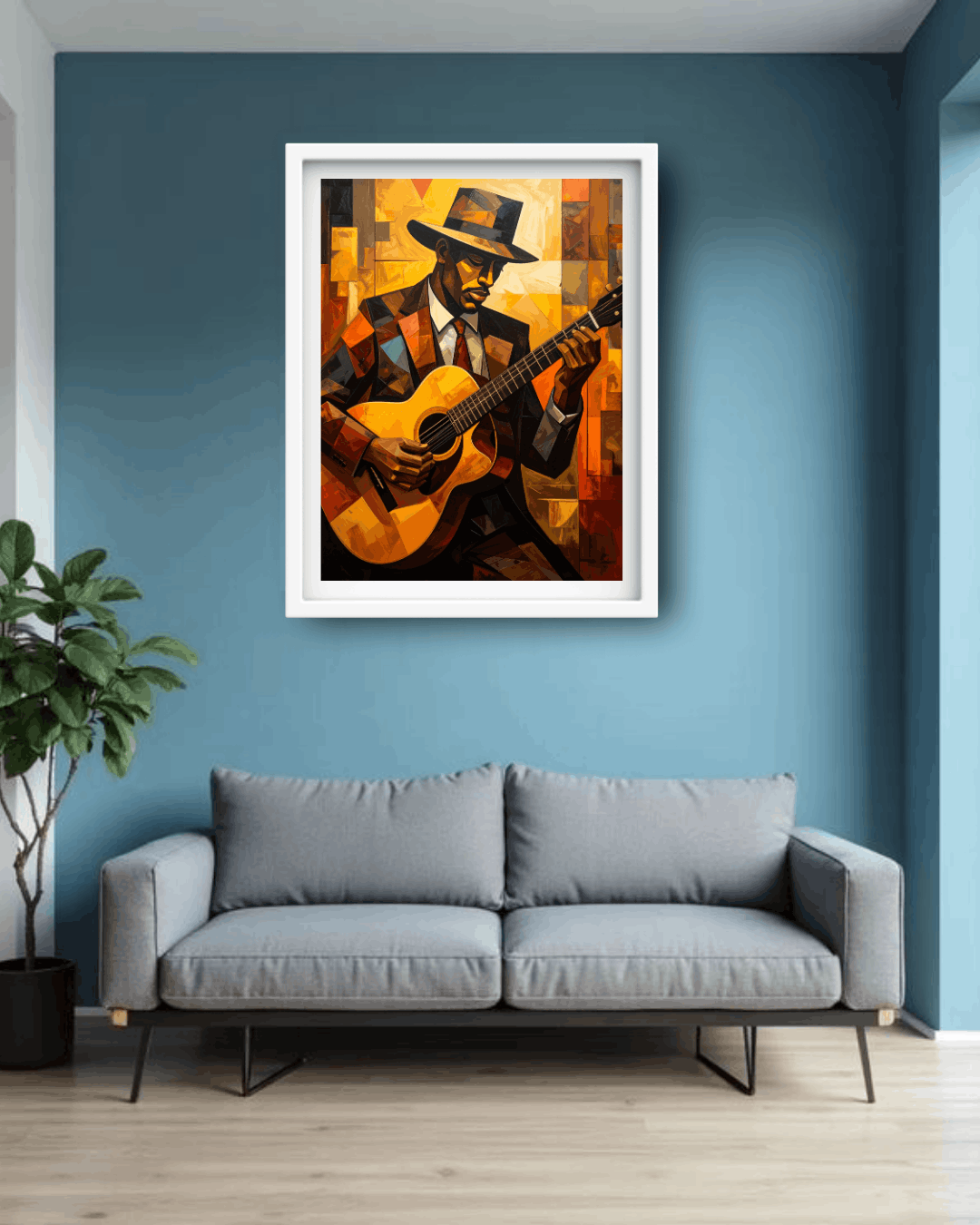 Framed artwork of a person playing guitar on a blue wall above a gray sofa.