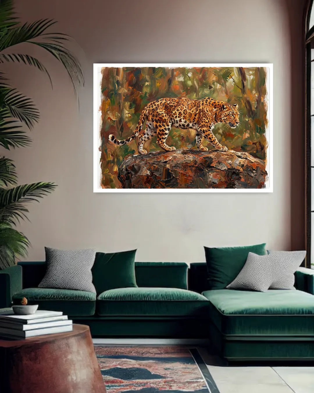 Framed painting of a leopard on a rock in a living room with a green sofa and decorative items.