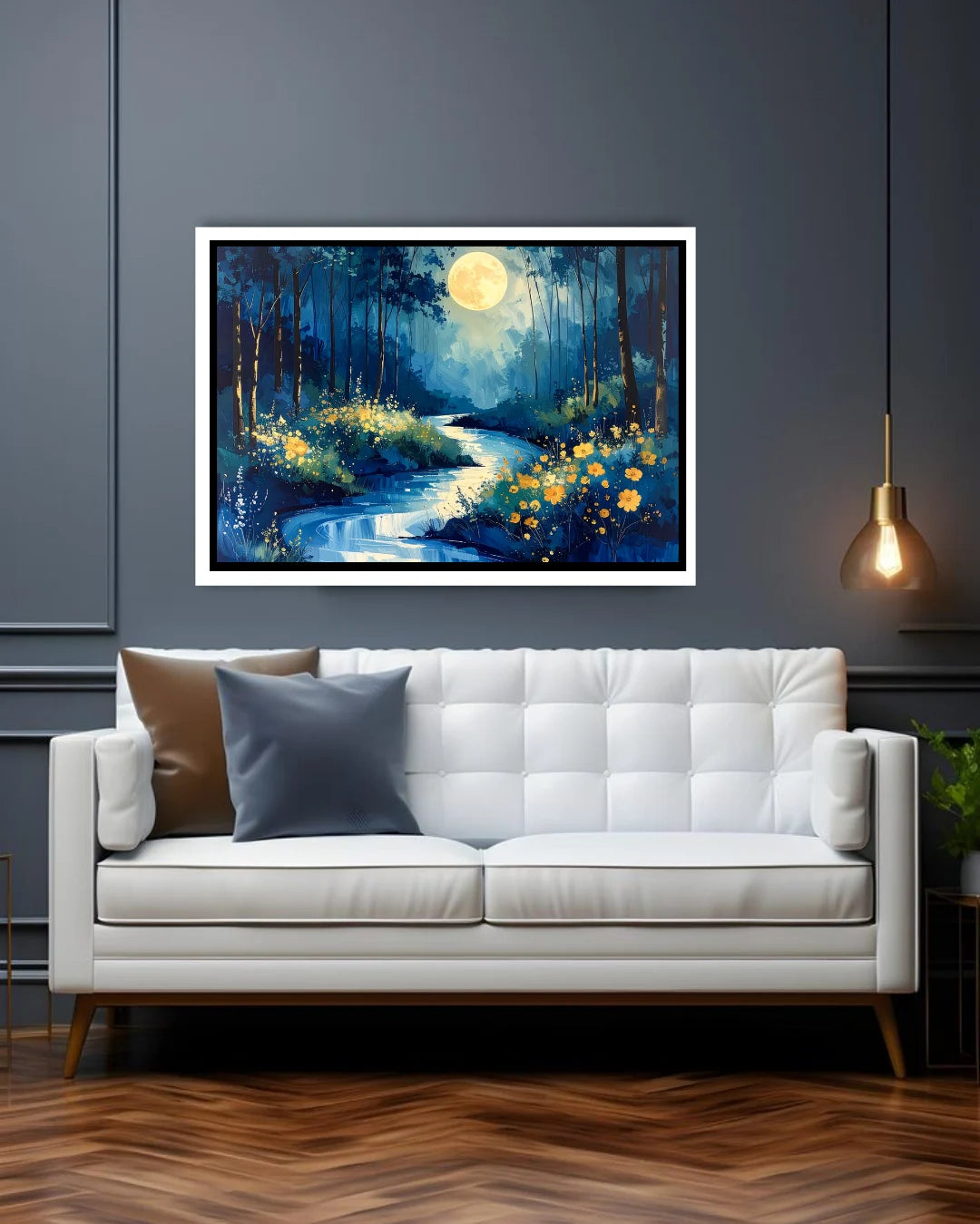 Framed artwork of a forest scene with a moonlit sky above a white sofa.