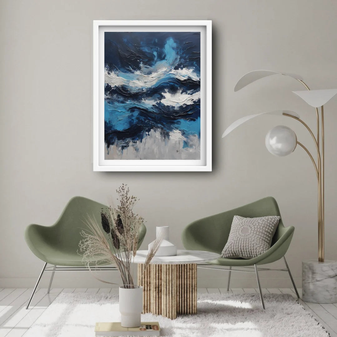 Blue abstract ocean wall art showcased above a sofa in a minimalist décor setup.