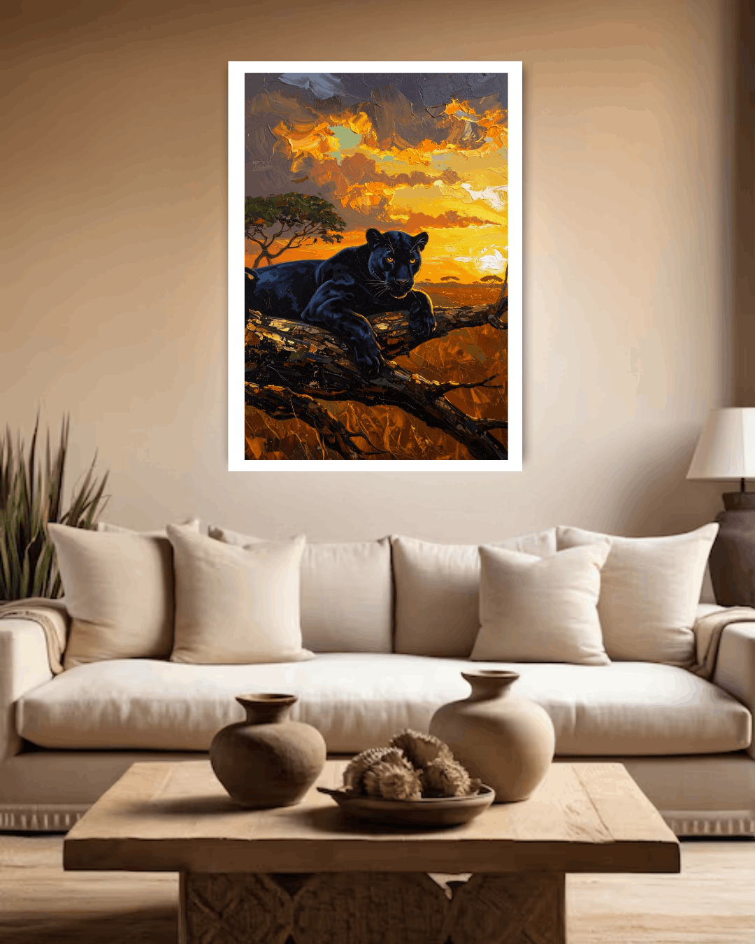 Living room with a couch, coffee table, and wall art of a panther at sunset.