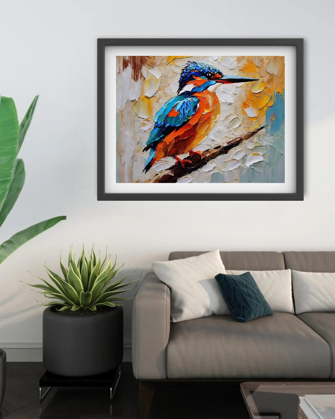 Framed painting of a colorful bird on a wall above a sofa with decorative pillows.