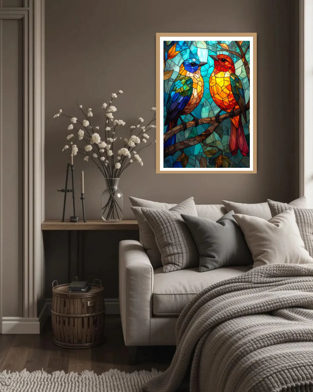 Colorful stained glass-style artwork of birds on a wall above a sofa in a living room.