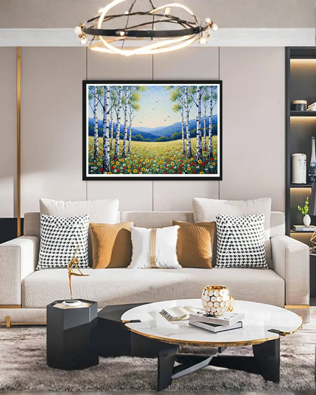 Modern living room with a sofa, coffee table, and wall art of a forest scene.
