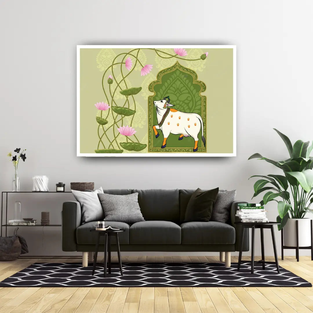 Living room with a gray sofa, decorative rug, and a framed artwork of a cow and lotus flowers on the wall.
