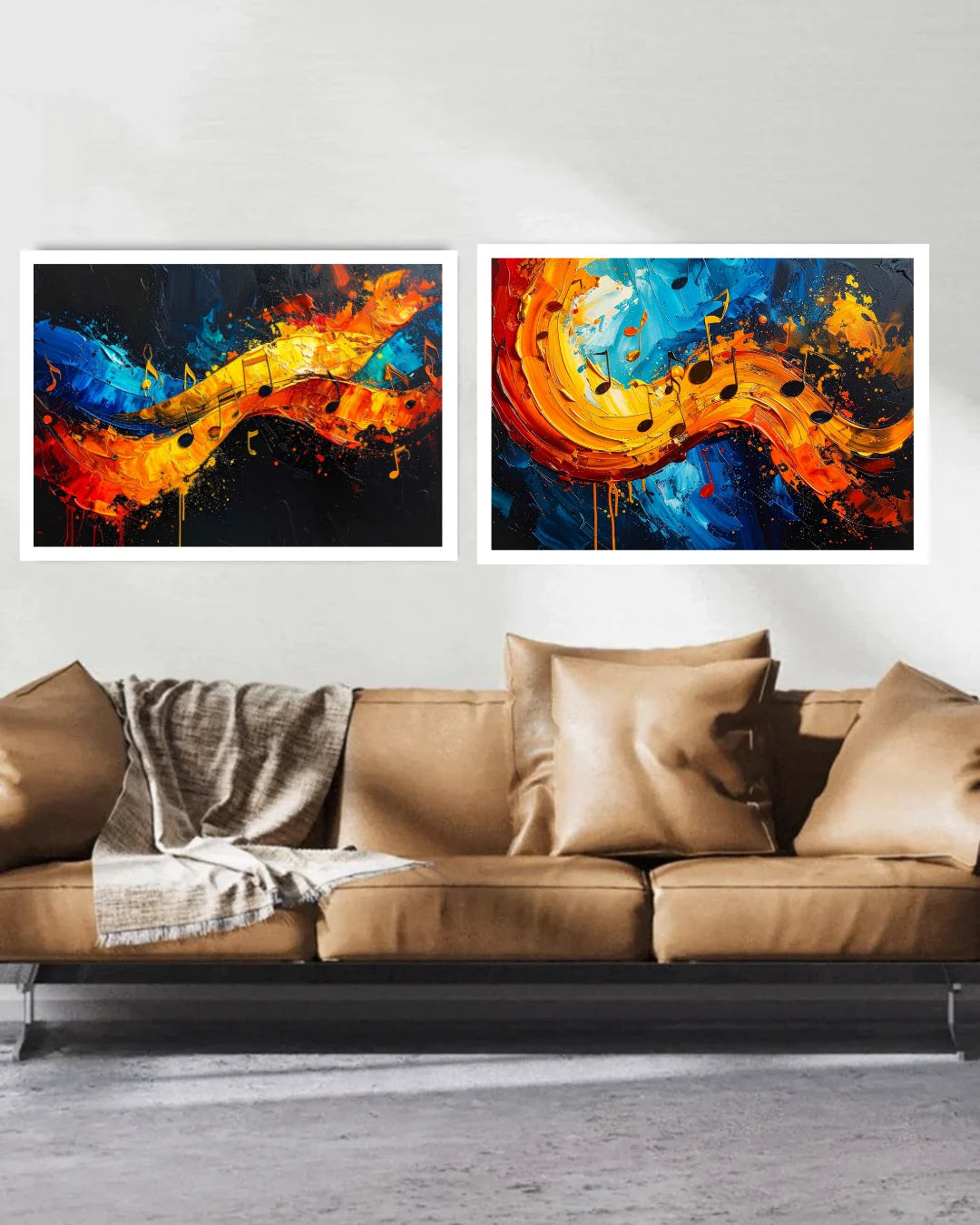Two abstract paintings above a brown sofa with decorative pillows and a blanket.