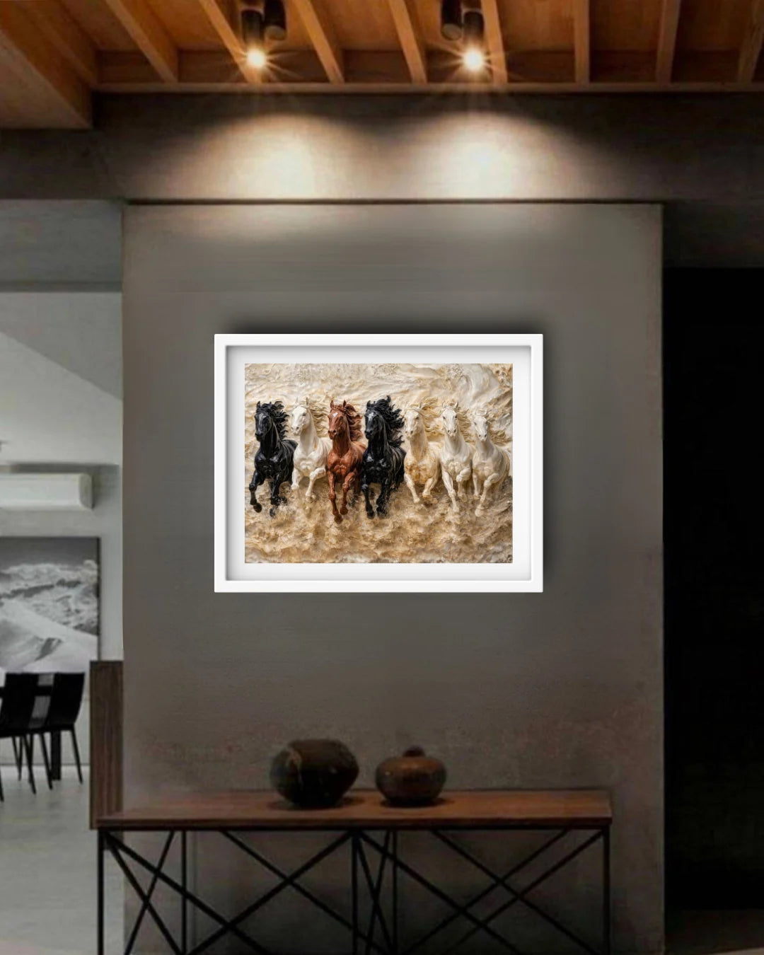 Framed artwork of horses on a wall in a modern interior setting.