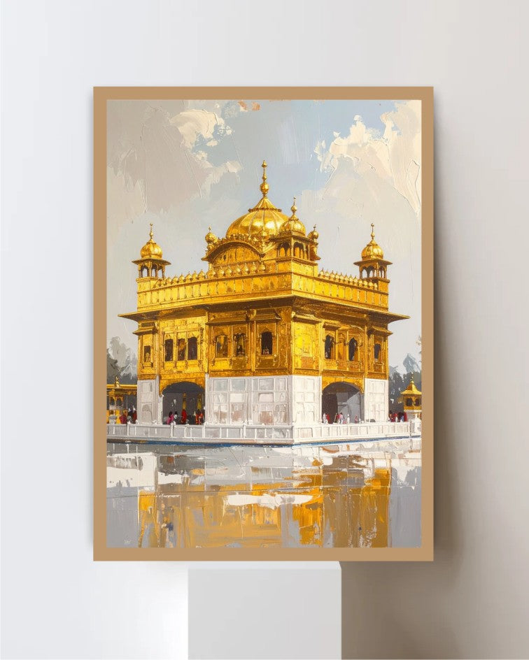 A framed art print depicting the Golden Temple in Amritsar, shown hanging on a light gray wall above a white pedestal. The artwork features a golden structure with white marble-like lower sections and a reflective pool below, under a pale blue and white sky.