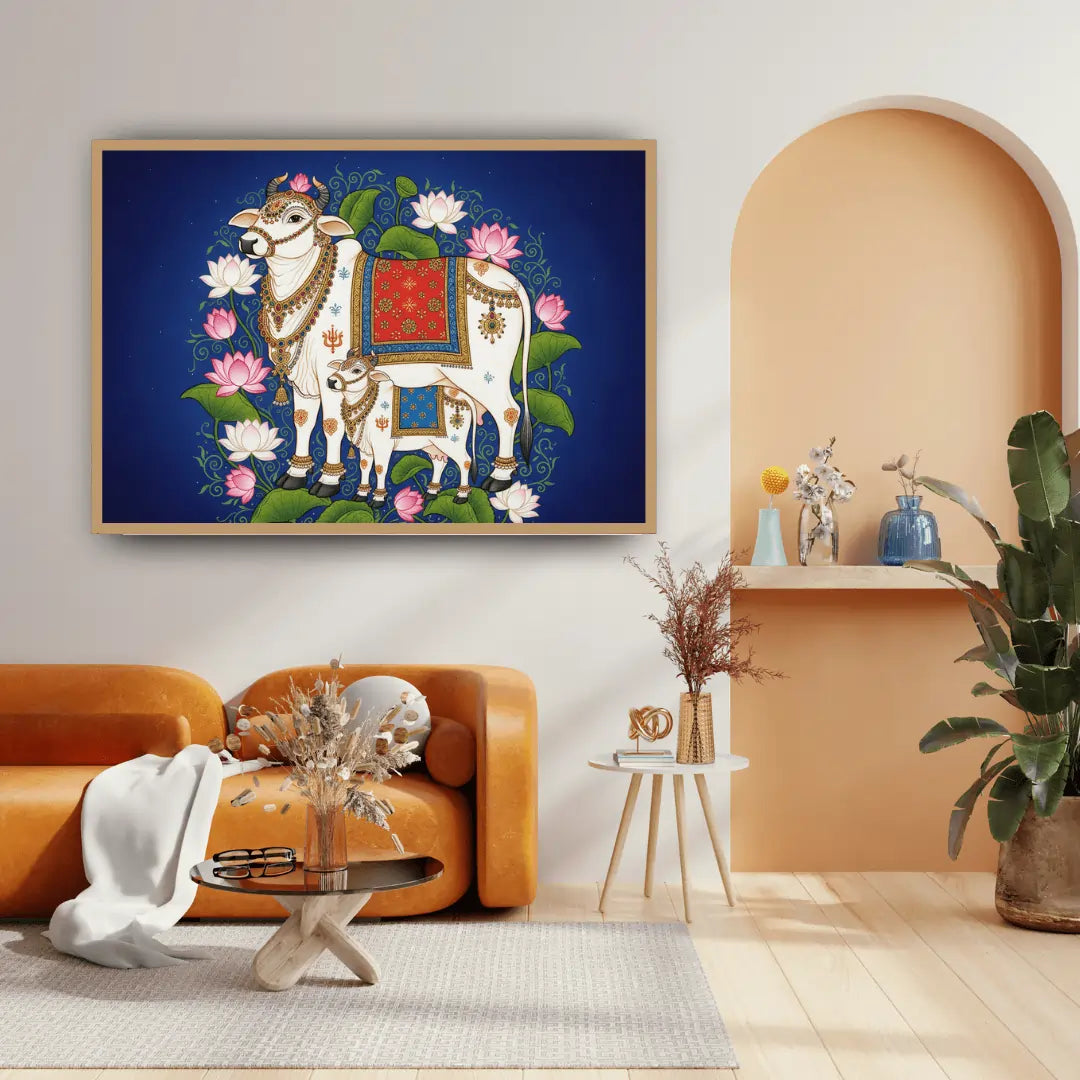 Decorative painting of a cow with flowers on a blue background in a living room setting.