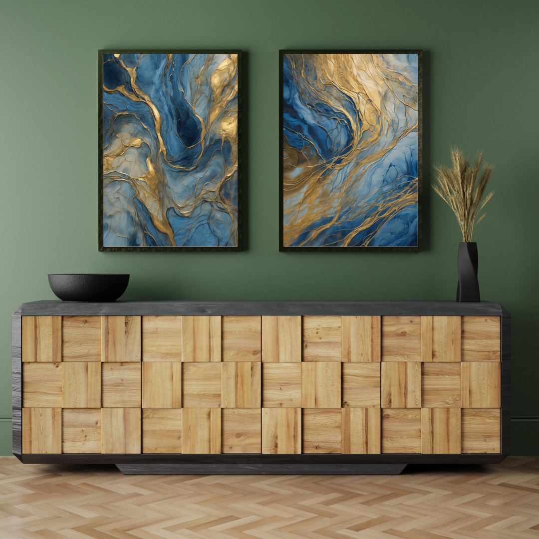 Set of abstract blue and gold paintings hung on a dark modern wall with décor accents.