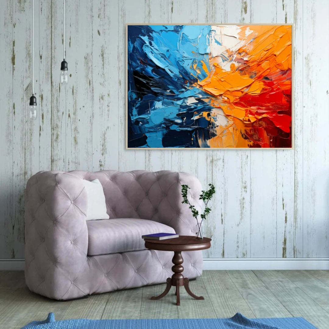 Blue orange abstract canvas art showcased in a bright lounge area with neutral seating.