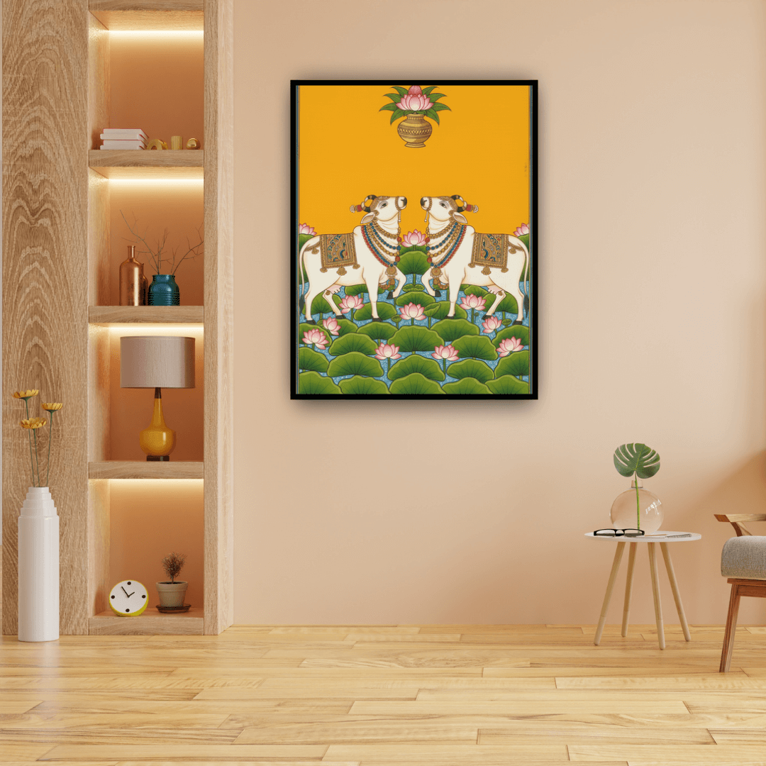 Framed artwork of two white cows with a yellow background in a room with wooden floor and shelves.