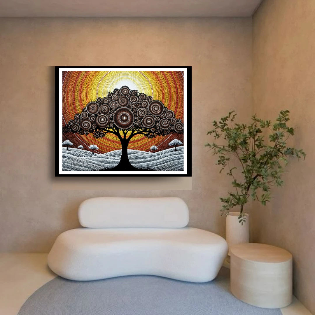 Framed abstract artwork of a tree with a sunset on the wall above a modern white sofa.