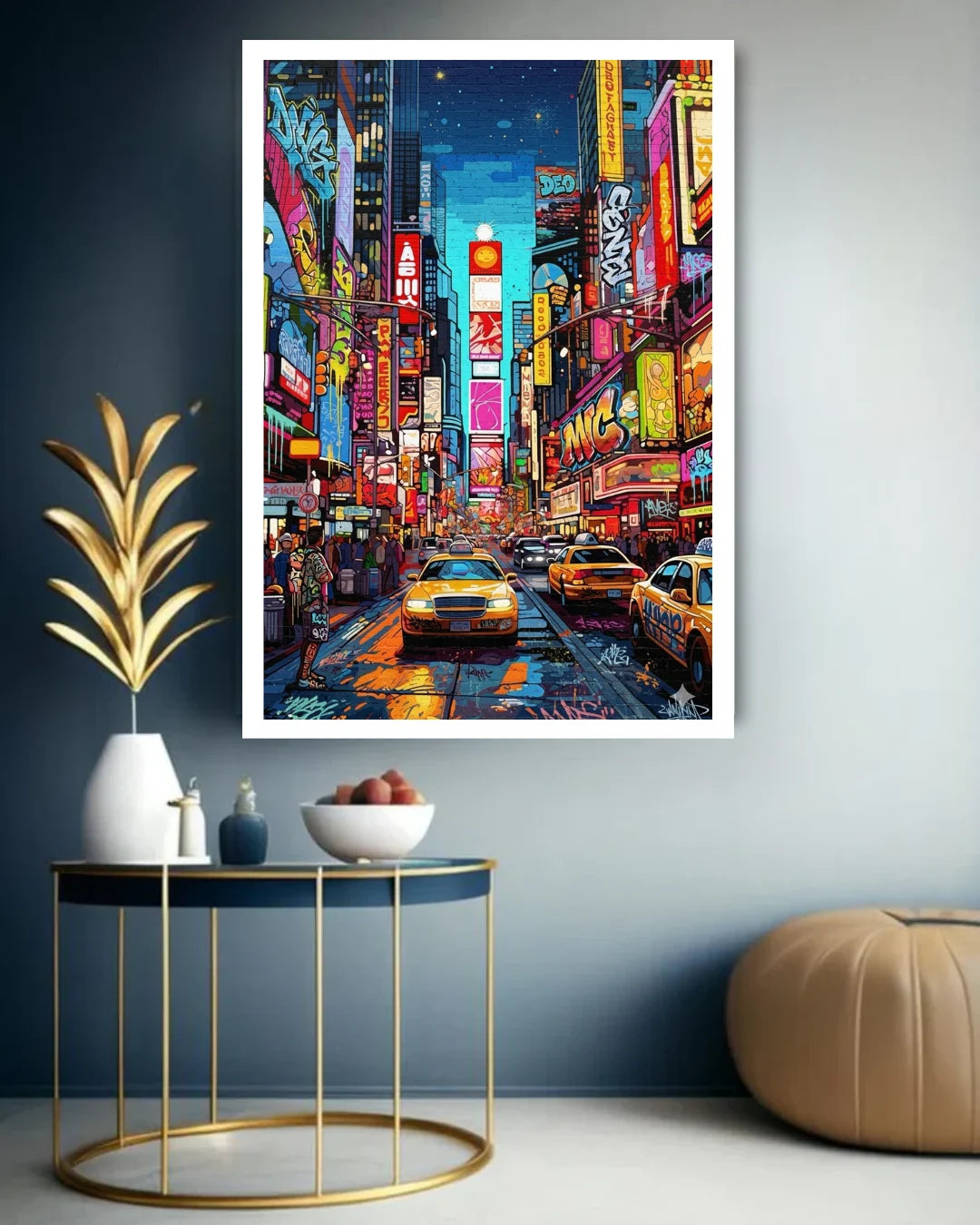 Framed artwork of a vibrant city street scene with neon lights and taxis, displayed on a wall.