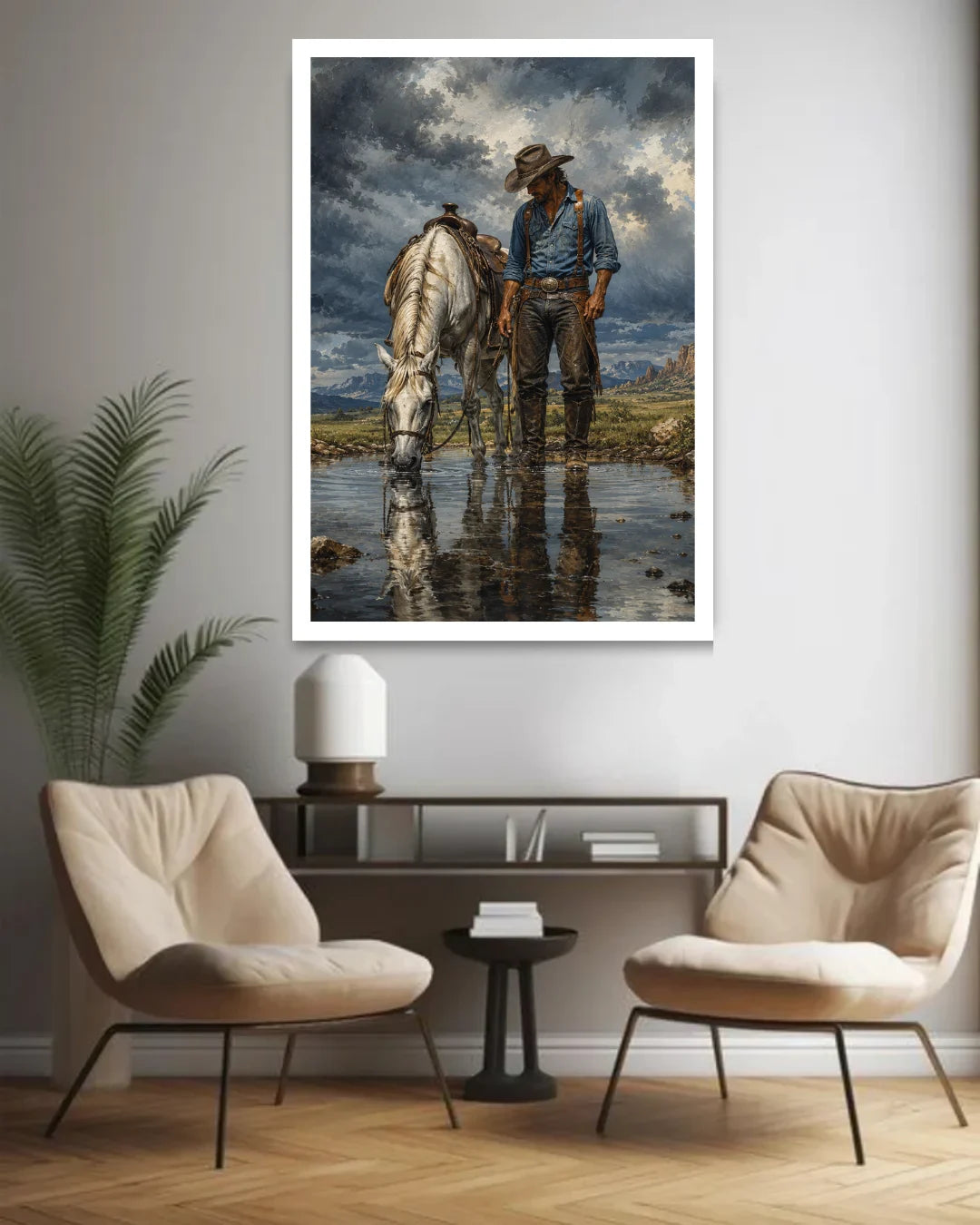 Framed cowboy and horse wall art above two lounge chairs in a contemporary living room.