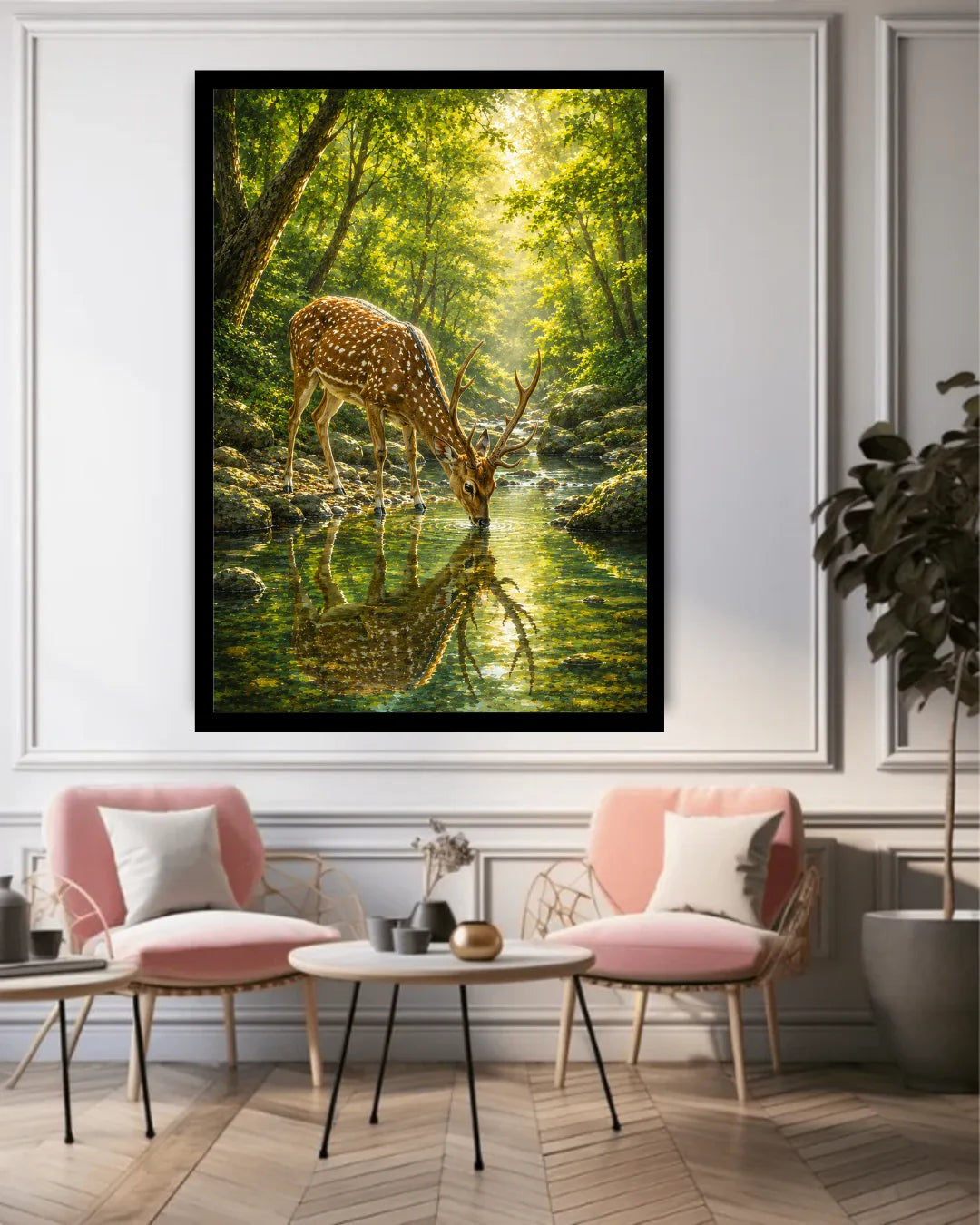 Framed nature print of a deer in a forest scene above a living room setup with pink chairs and a coffee table.
