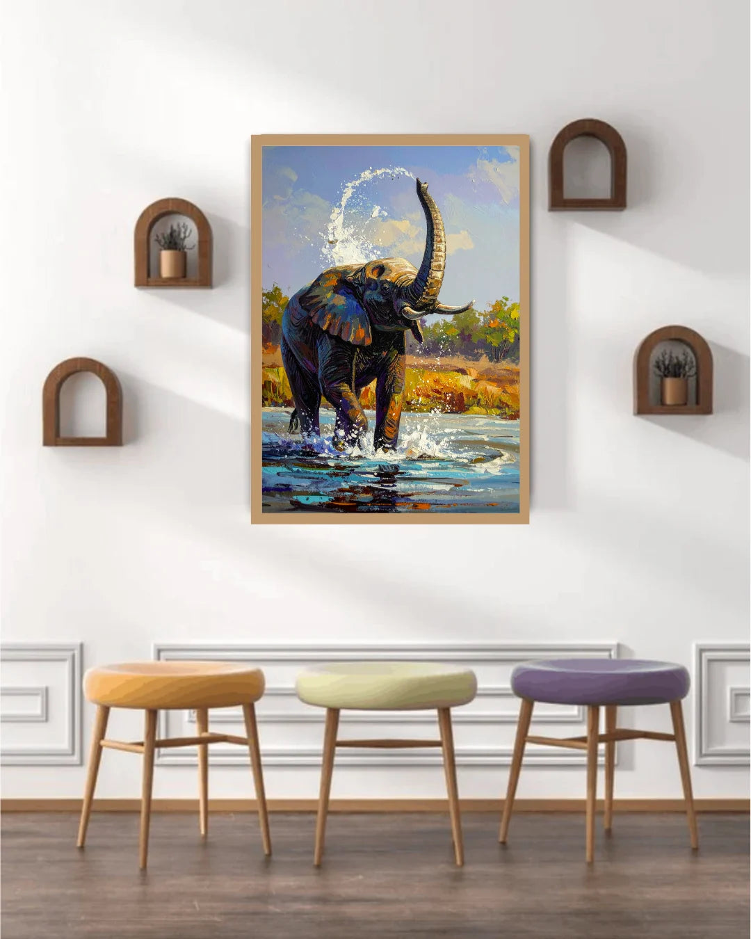 Framed artwork of an elephant in a natural setting on a wall above three colorful stools.