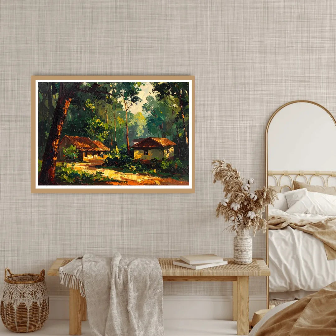 Framed painting of a forest scene on a wall above a wooden bench with a vase and books.
