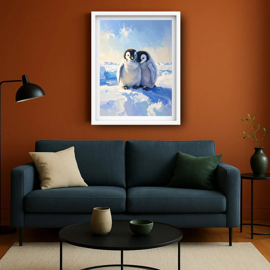 framed picture of penguins on an orange wall.