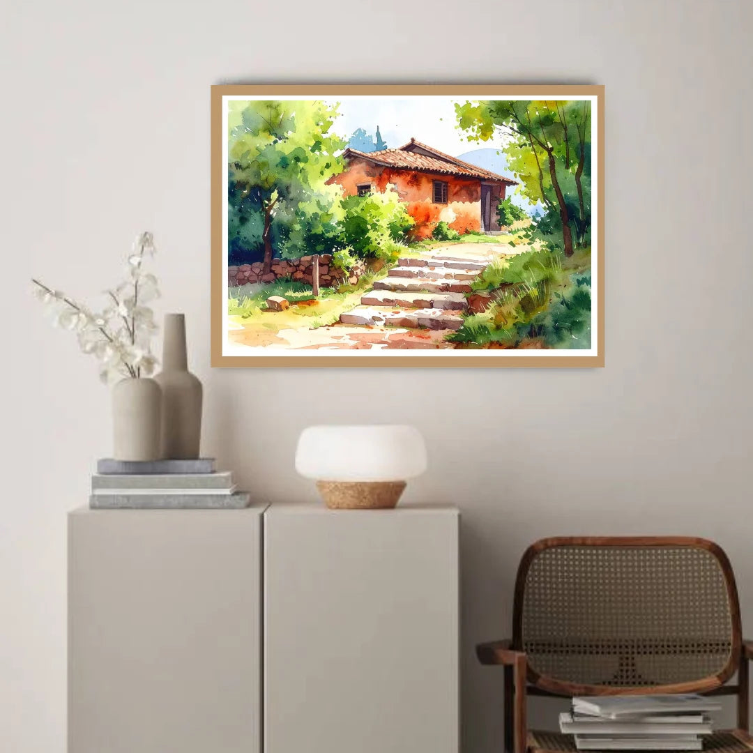 Framed landscape painting of a rustic house with a staircase on a wall above a cabinet.