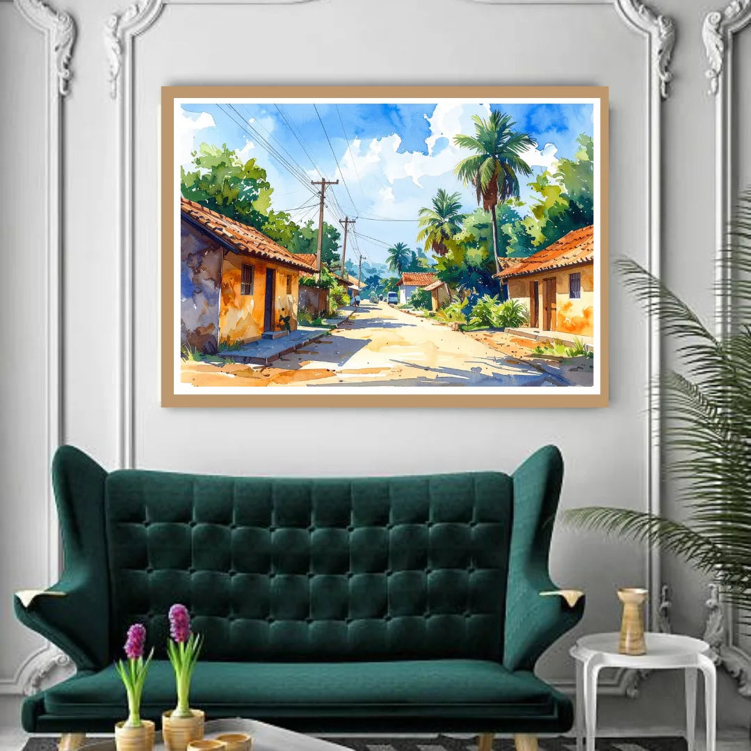 Framed painting of a tropical street scene above a green sofa in a room with decorative elements.