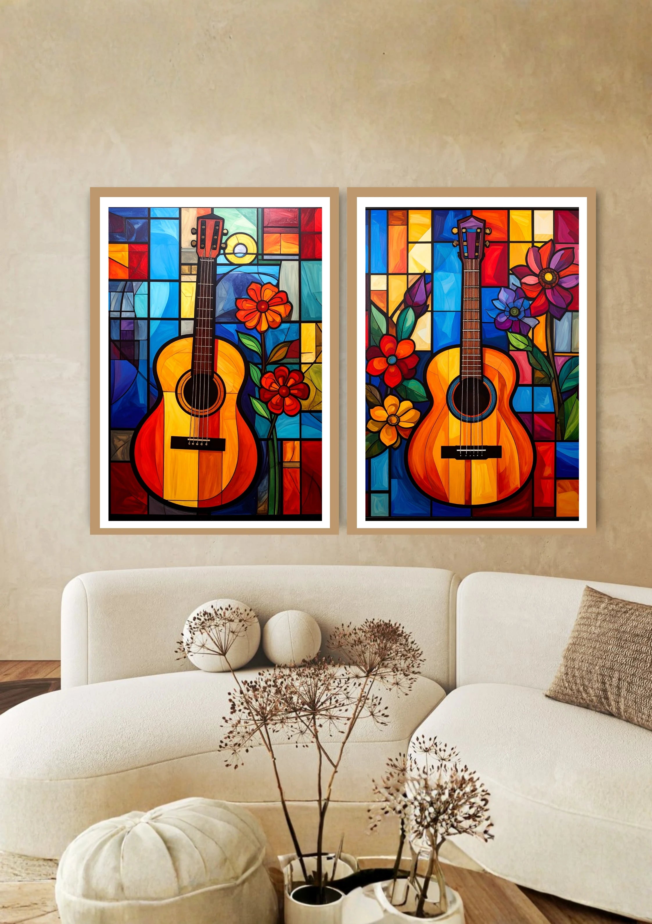 Two colorful abstract paintings of guitars on a wall above a white sofa.