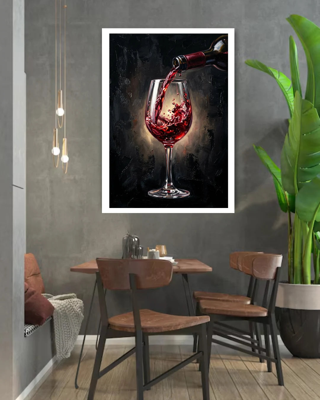 Dining area with a framed picture of red wine being poured on the wall.