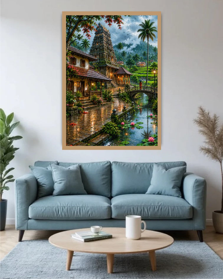 A large framed wall art print depicting a lush tropical temple scene with a canal, bridge, and palm trees, displayed above a light blue sofa in a modern living room setting.