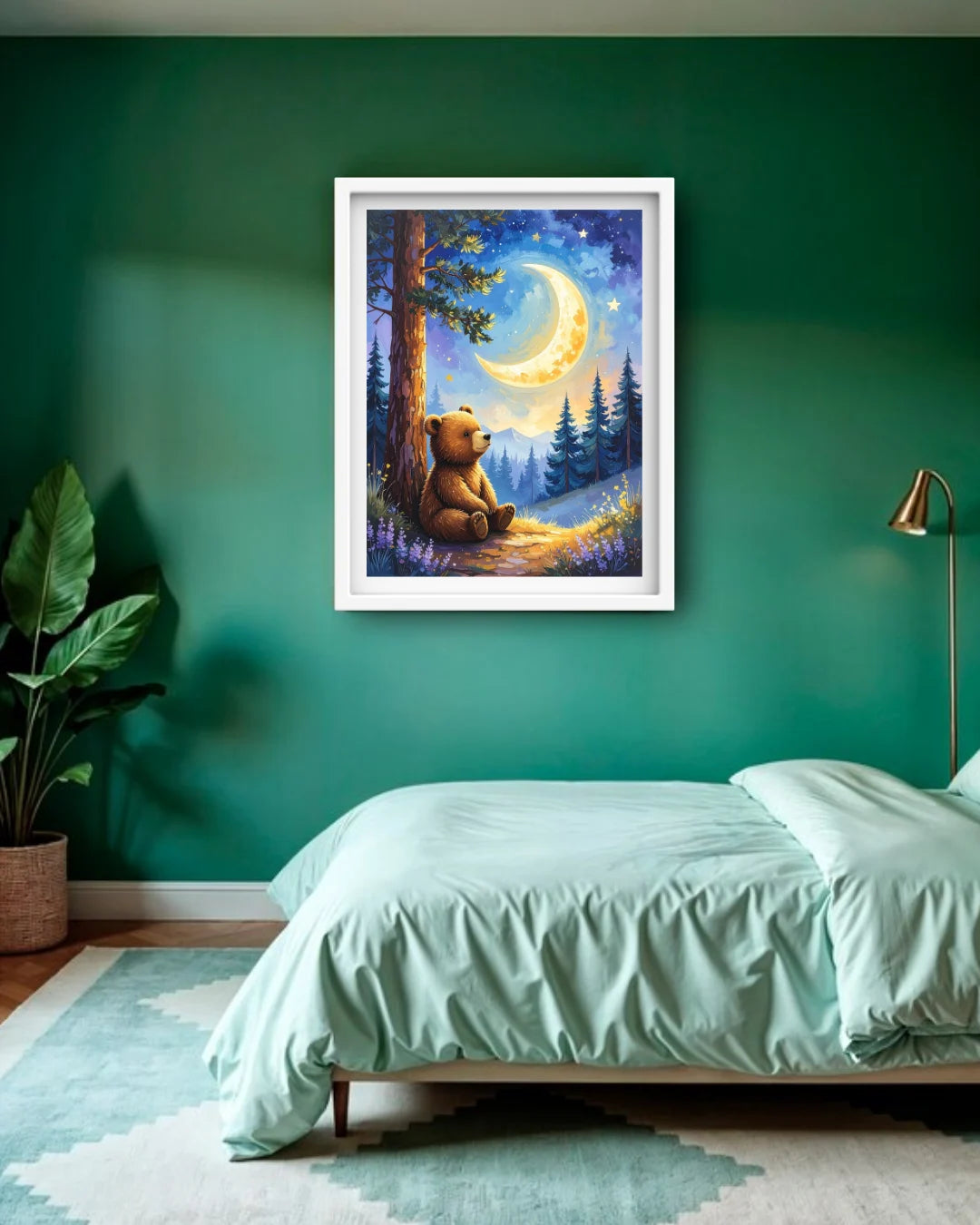 A framed art print depicting a cozy bear sitting under a crescent moon in a forest, displayed on a dark green wall above a bed in a styled bedroom.