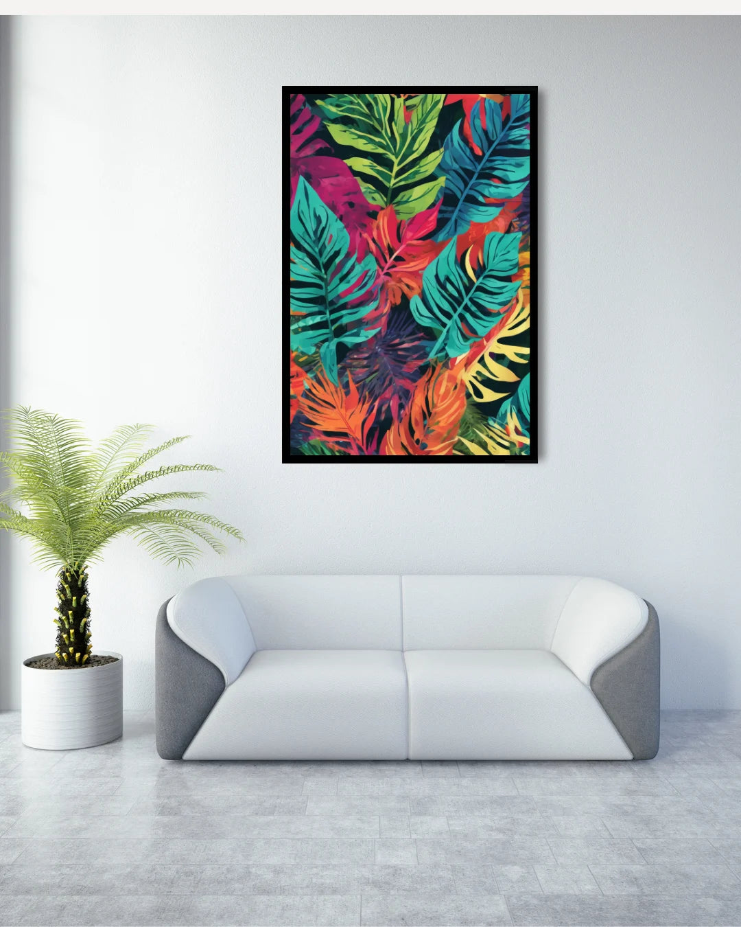 Colorful abstract leaf print on a wall above a modern white sofa with a plant beside it.