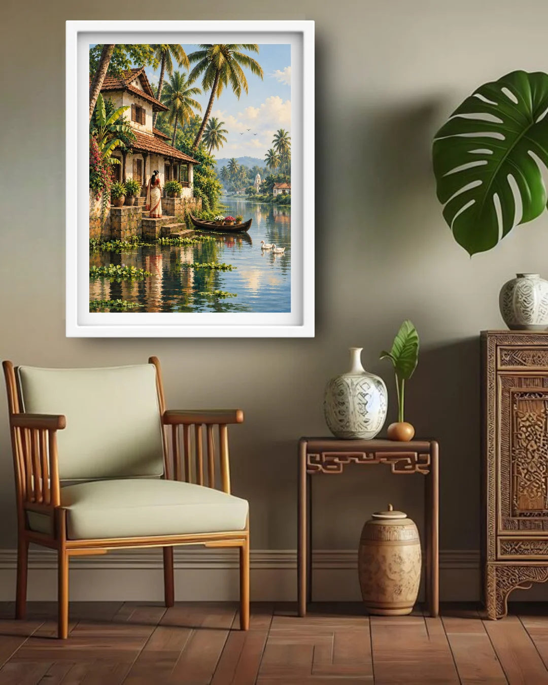 A framed landscape art print depicting a tropical water village with palm trees and a boat, displayed on a gray wall in a styled room with a wooden chair, side table, and decorative vases.