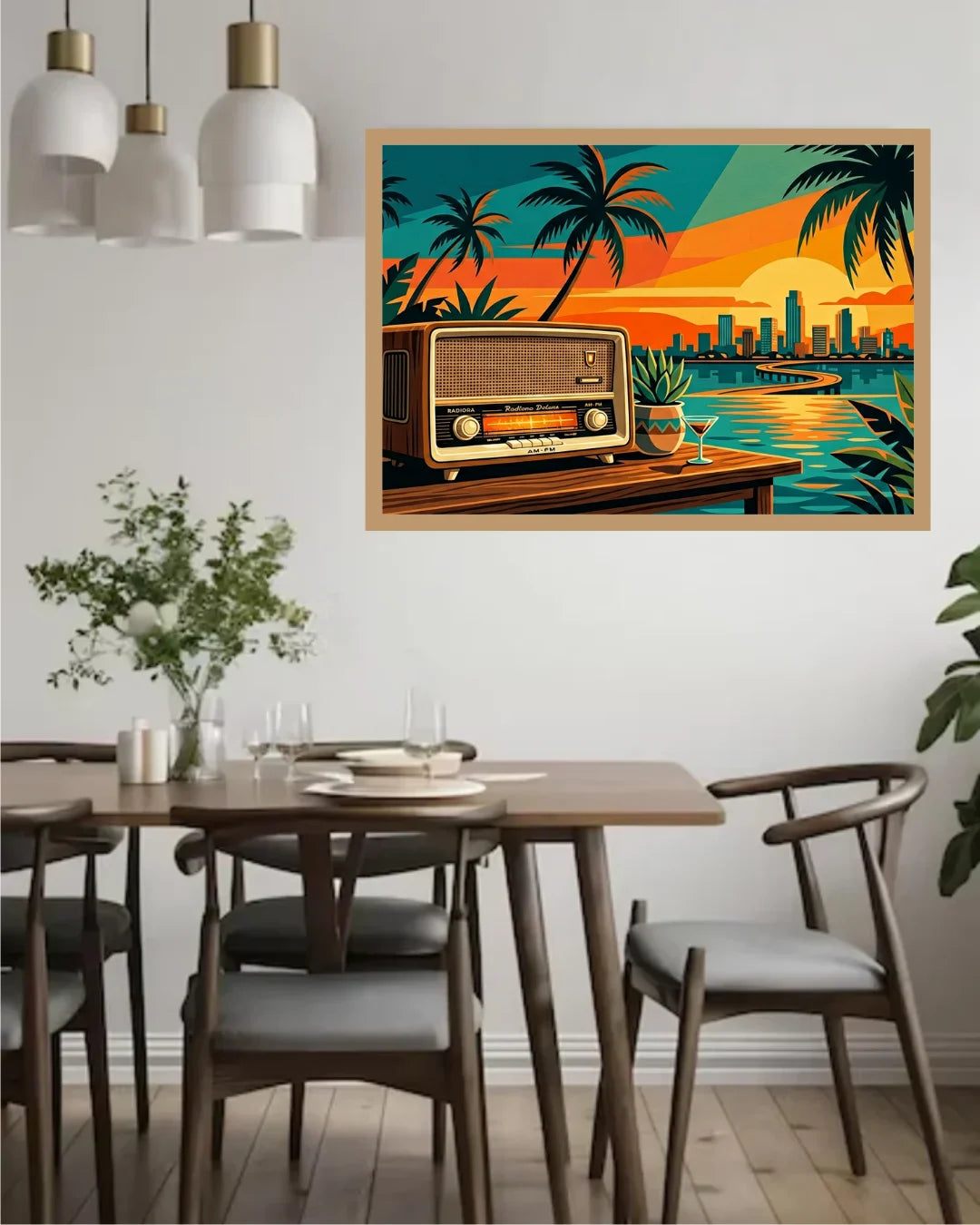 A framed wall art print featuring a retro radio, palm trees, water, and a sunset city skyline, displayed above a wooden dining table in a modern dining room.