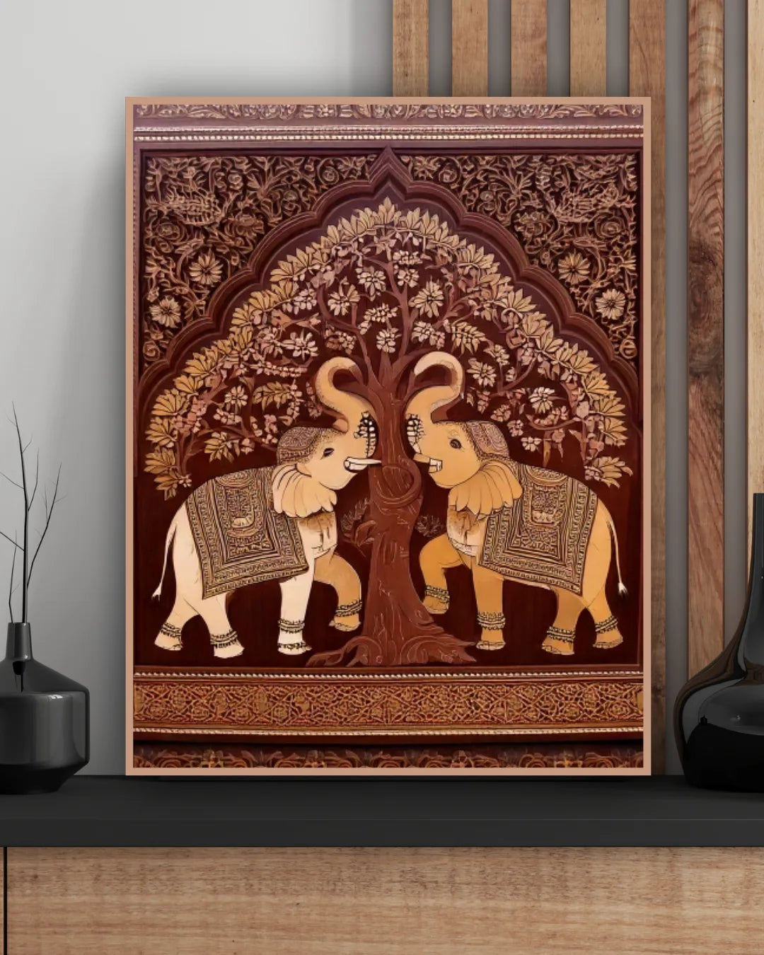 Decorative wall tapestry with two elephants under a tree on a wooden shelf.