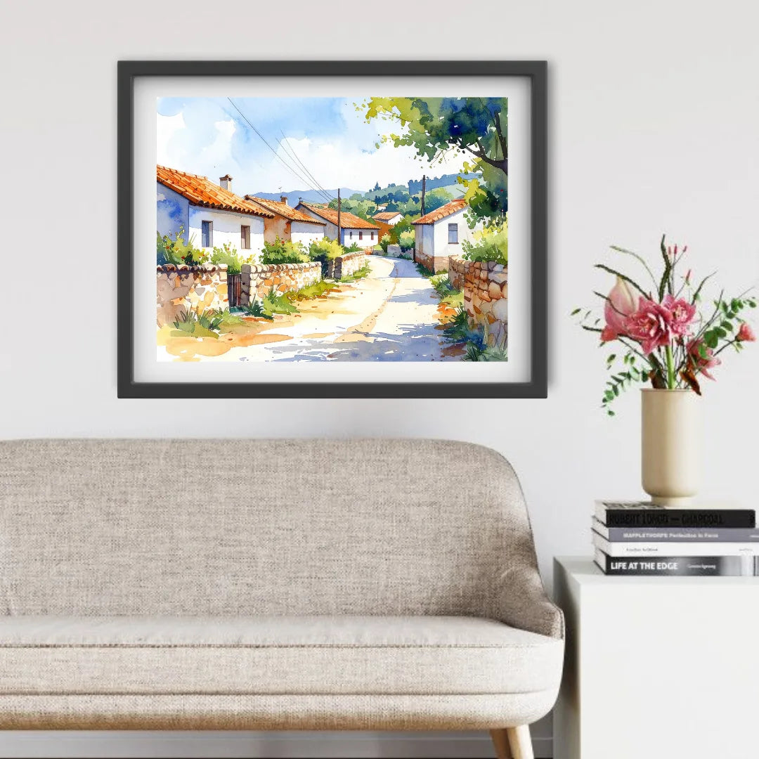 Framed painting of a village scene above a sofa in a living room.