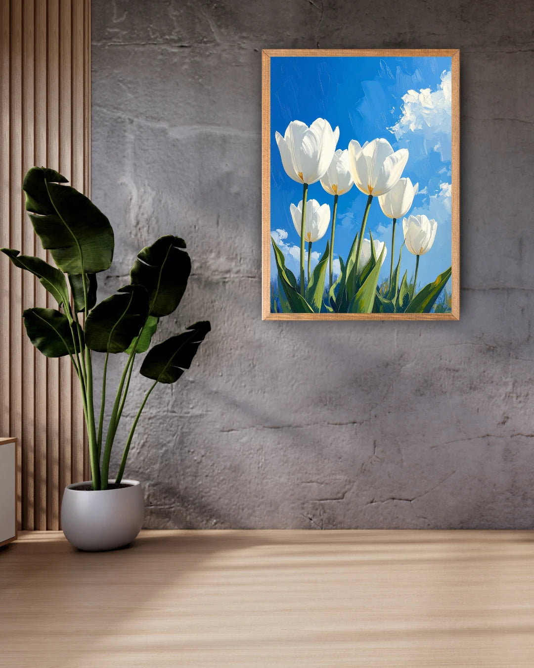 White tulip floral wall art canvas displayed on a grey wall with indoor plant