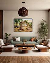 Living room with a painting of a village scene on the wall, green sofa, and wooden furniture.