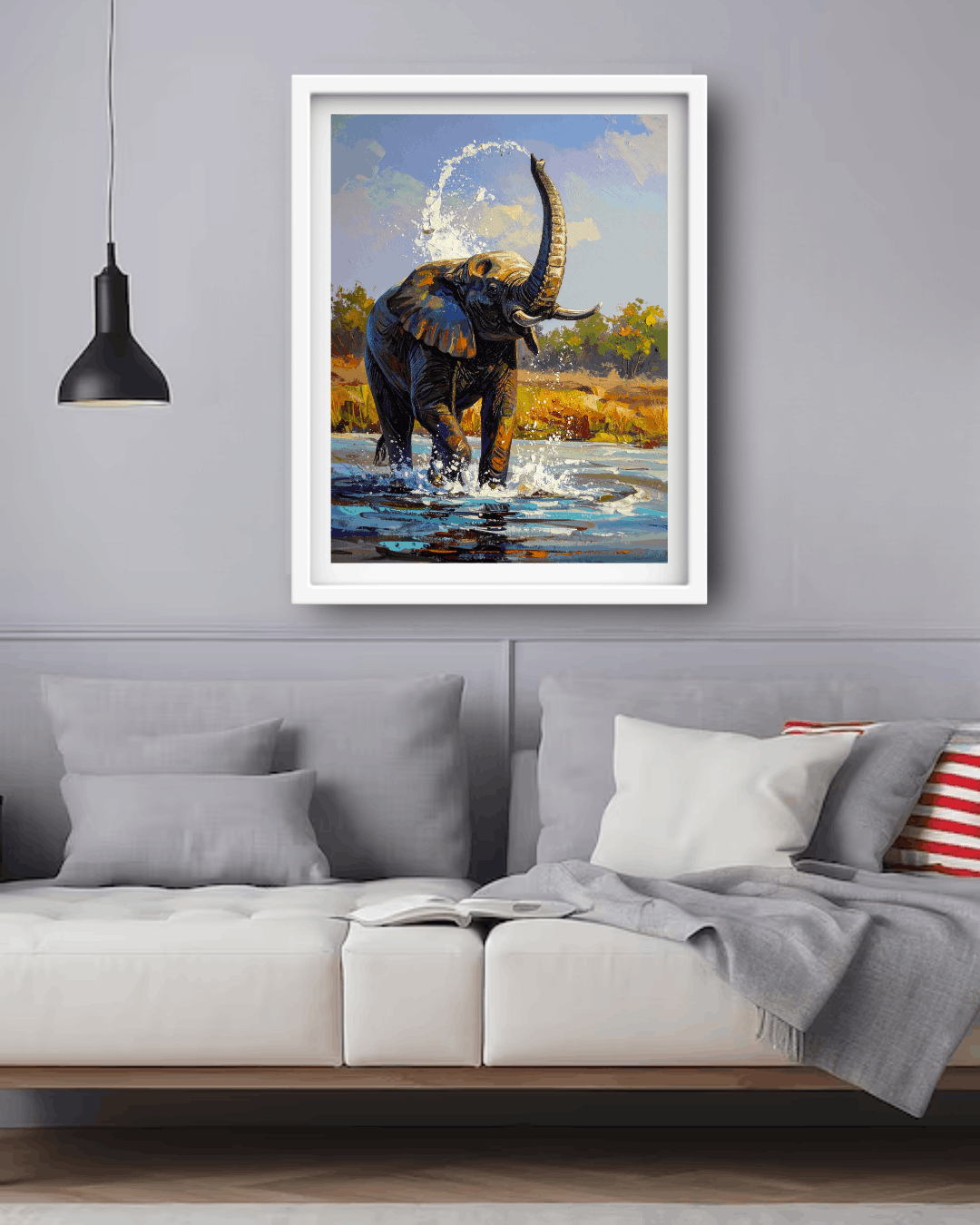 Framed painting of an elephant in a natural setting above a sofa in a living room.