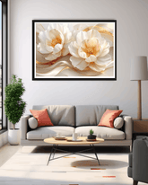 Living room with a gray sofa, coffee table, and decorative wall art of white flowers.