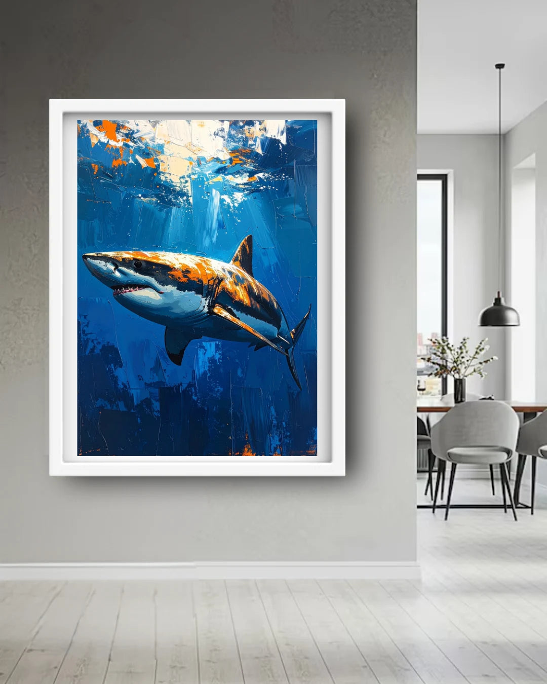 Framed artwork of a shark in an underwater scene on a wall in a modern interior setting.