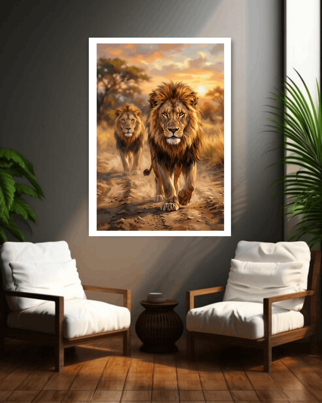 Framed artwork of two lions walking together in a savannah scene, displayed on a wall above two white chairs.
