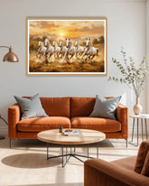 Living room with a brown sofa, round coffee table, and a large framed painting of running horses on the wall.