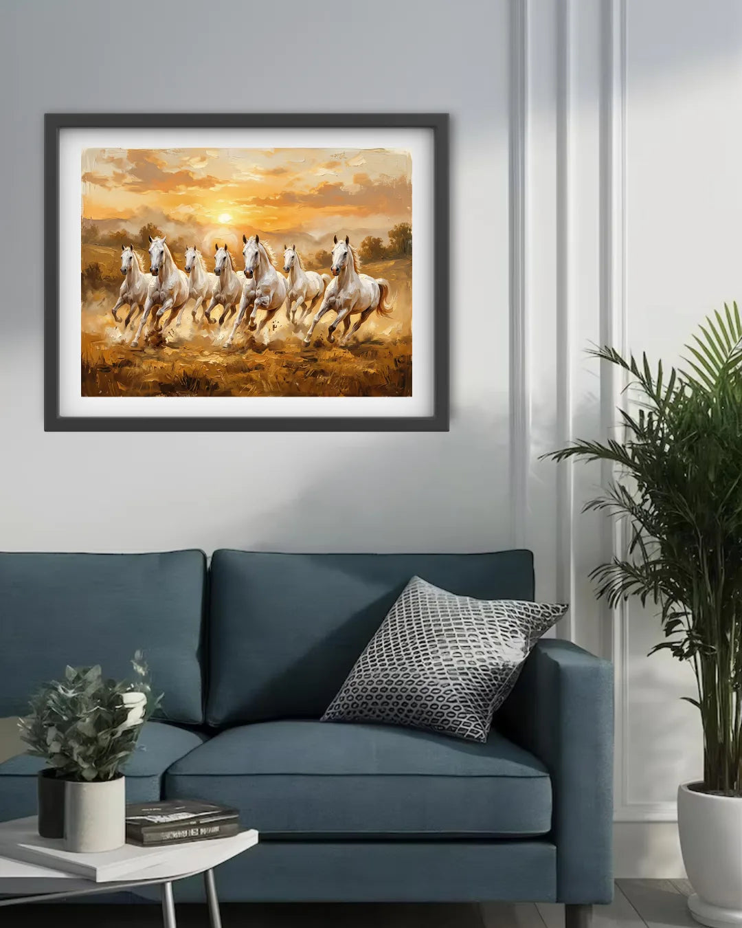 Framed artwork of running horses on a wall above a blue sofa with decorative pillows.