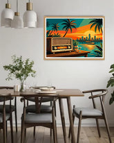 Dining room with a framed artwork of a radio by a lake and palm trees.