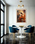 Dining room with blue chairs, white table, and a large painting of a woman playing a piano on the wall.