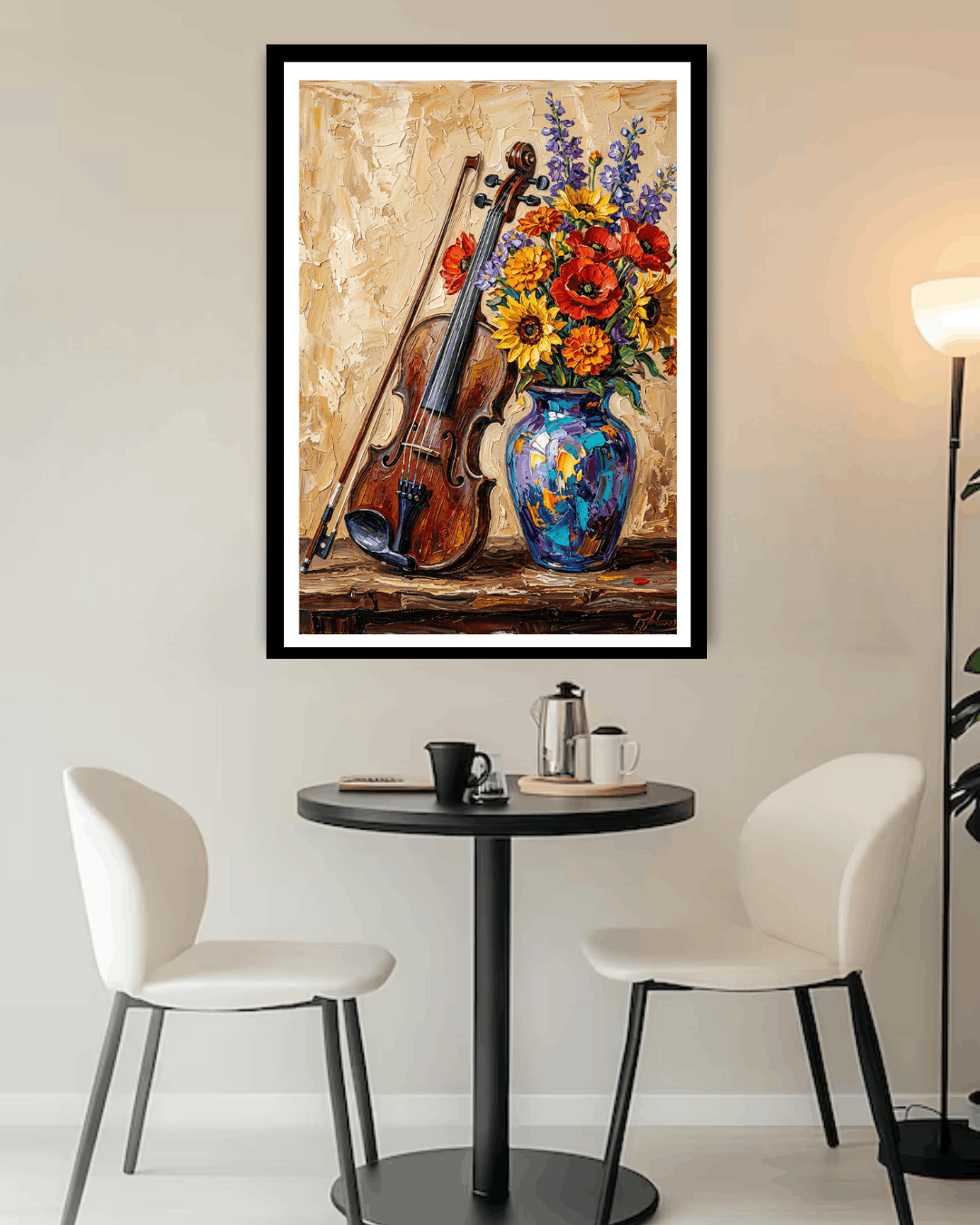 Framed artwork of a violin and flowers on a wall above a table with chairs.