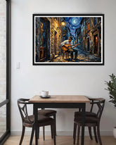 Framed artwork of a musician playing guitar on a city street at night, above a dining table.