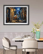 Framed painting of a musician playing guitar on a street at night above a dining table.