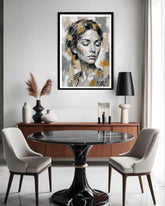Dining room with a black marble table, white chairs, and a large framed portrait on the wall.