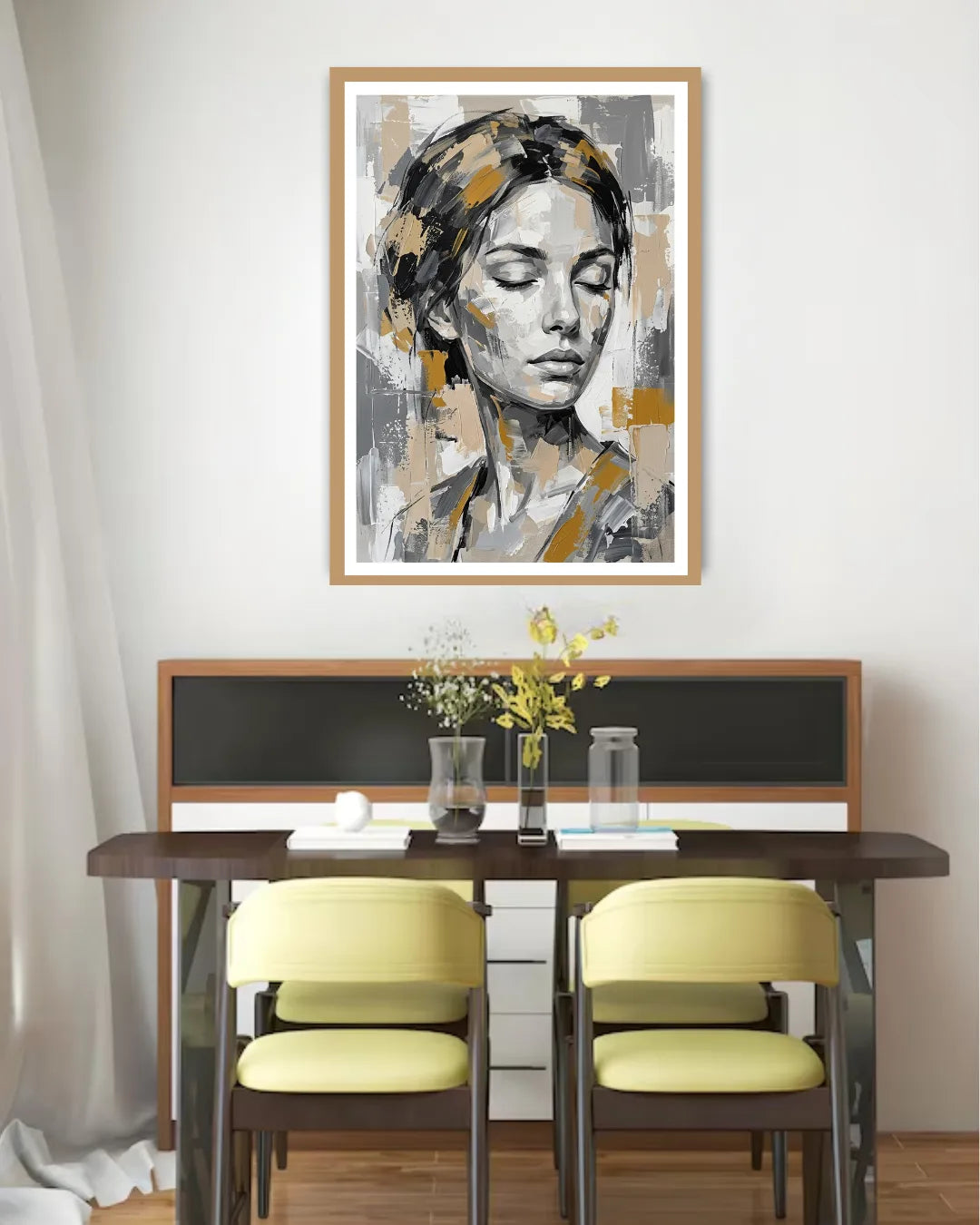 Dining room with a table and chairs, and a framed abstract art piece on the wall.