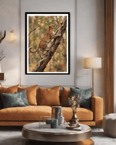 Living room with a framed painting of a leopard on a tree branch, orange sofa, and decorative items.